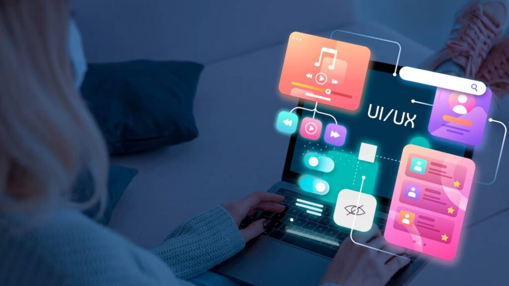 A person using a laptop with futuristic UI/UX design elements representing no-code and low-code mobile app development, showcasing interactive visual components for app creation.